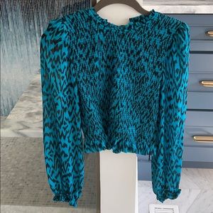 Wilfred blouse. Cropped, smocked, super sexy on!